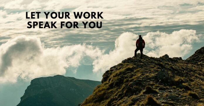 A single hiker standing on a sunlit mountain summit, representing the powerful quiet of letting their dedicated work speak for itself.