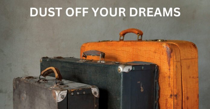 Old, dusty vintage suitcases reminding us to dust off our dreams and do what we want to do.