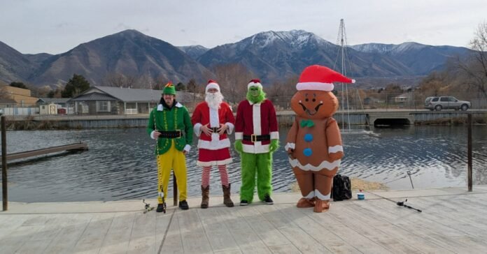 The Olson family dressed as The Grinch, Santa, The Gingerbread Man, and Buddy the Elf spreading holiday joy while fishing at Salem Pond.