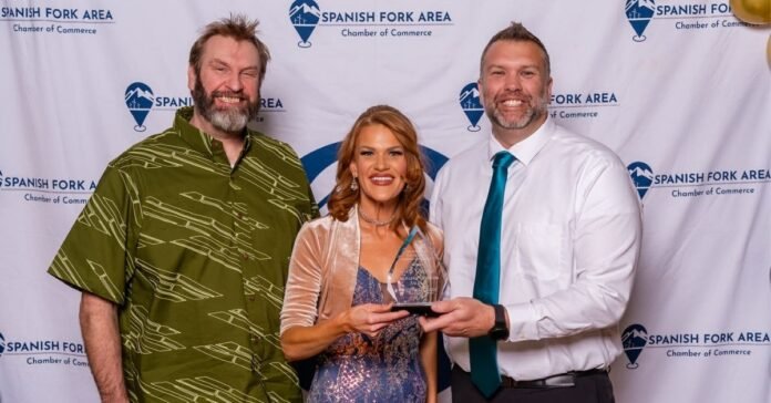 Owners of Good Grindz receiving an award from the Spanish Fork-Salem Chamber of Commerce at the annual awards gala.