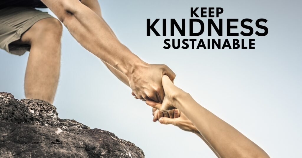 A person securely anchored on a rock while helping another, symbolizing safe boundaries and self-preparedness.