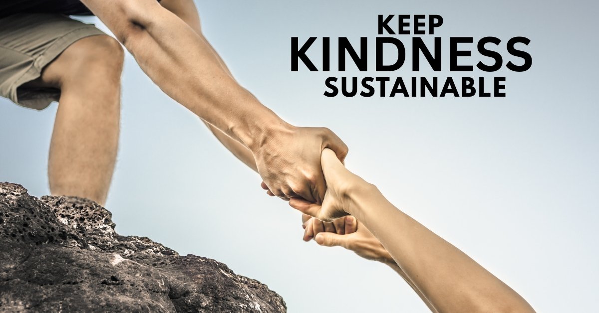 A person securely anchored on a rock while helping another, symbolizing safe boundaries and self-preparedness.