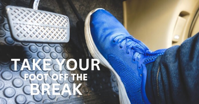 A symbolic image showing a foot no longer on a brake pedal, illustrating the Tika Buzoba principle of stopping stupid mistakes.